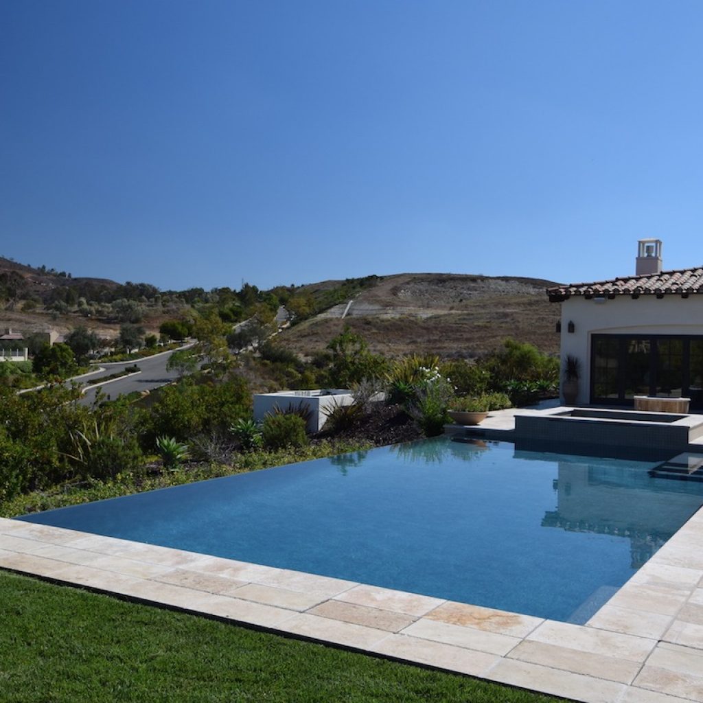 Infinity pool with natural stone deck