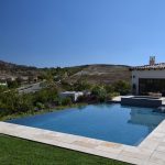 Infinity pool with natural stone deck