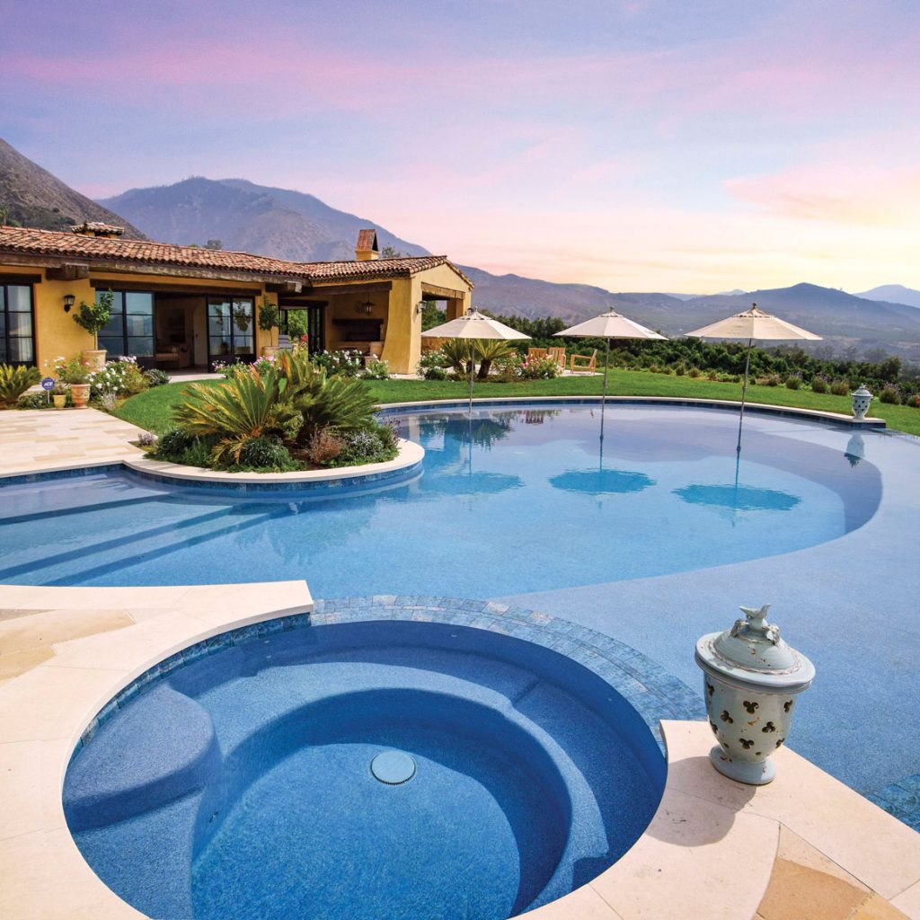 Pool and spa with sunset